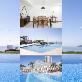 Apto Vista Mar Home Club Pé na Areia 3 Quartos Ares Condicionados Cozinha Completa Piscina Aquecida Jacuzzi Sauna Academia Quadra Playground Salão de Jogos 15min do Beto Carrero